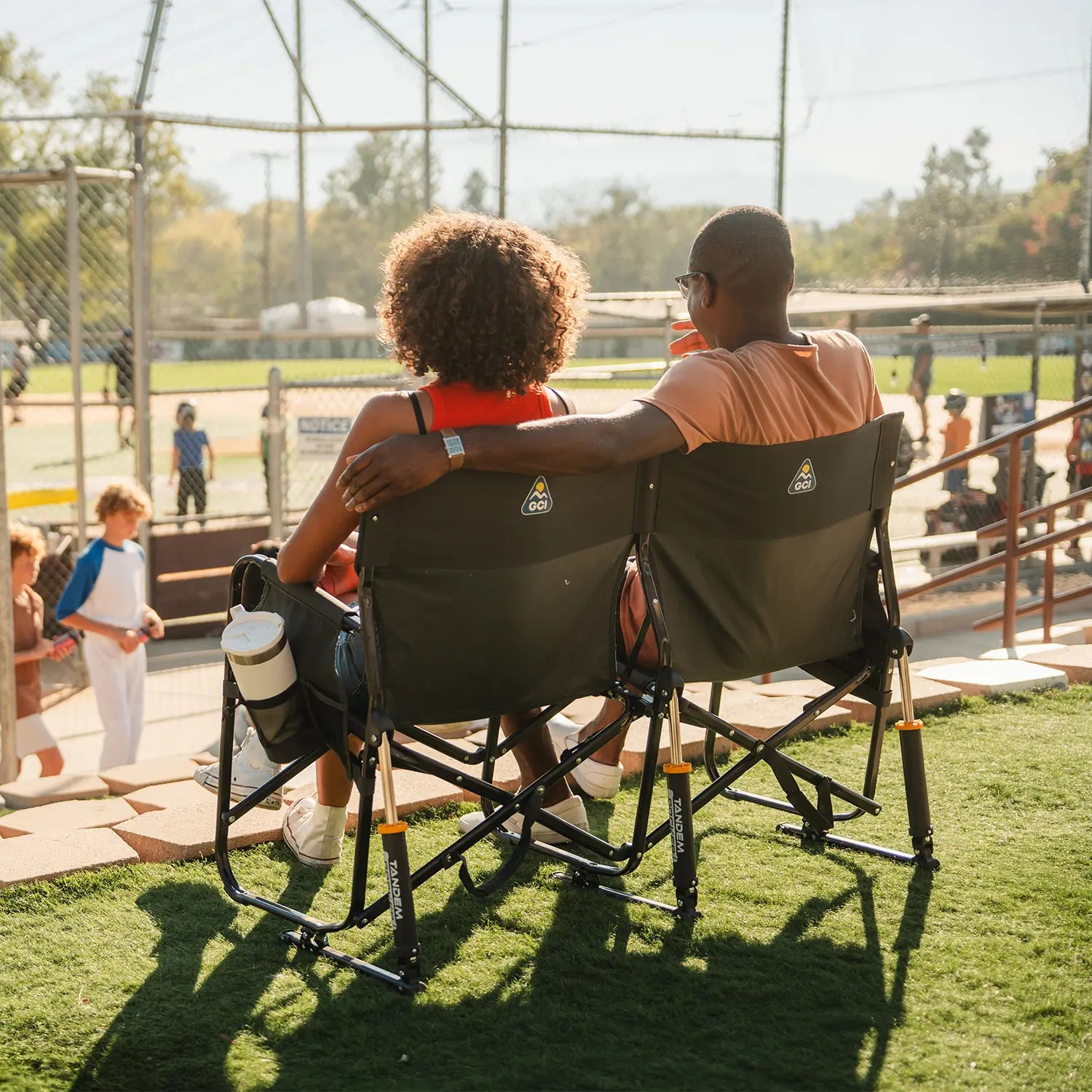 Tandem-Rocker-Baseball-Couple-Sitting-Behing-View